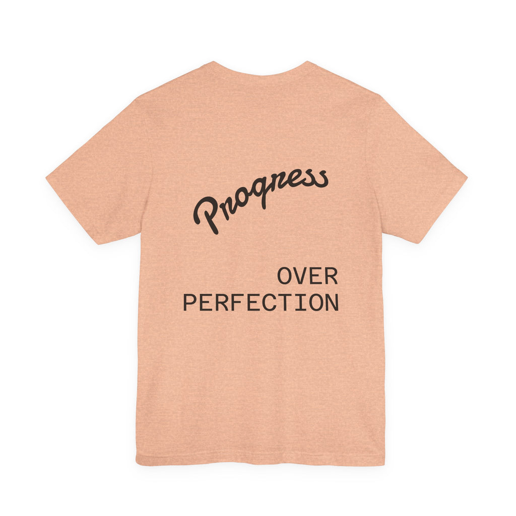Pride Week Rainbow Heart Tee — "Progress Over Perfection" Back Print
